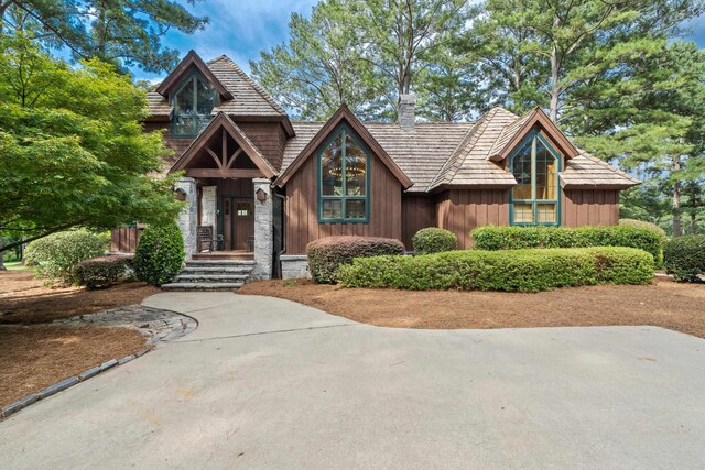 125 Secoffee Dr, Eatonton, GA 31024 - view of front facade with stone siding and a chimney