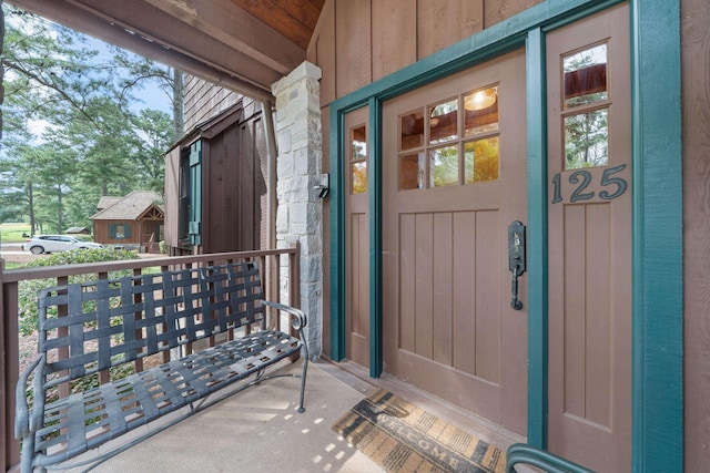 125 Secoffee Dr, Eatonton, GA 31024 - doorway to property with a porch and board and batten siding