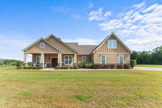 115 Sage St, Eatonton, GA 31024 - craftsman house with board and batten siding, stone siding, a front lawn, and covered porch