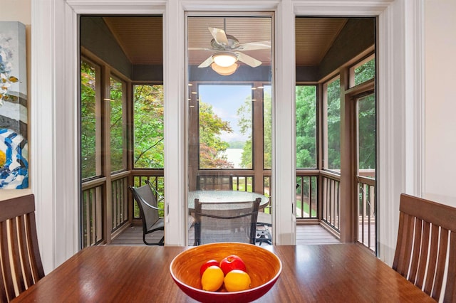 sunroom / solarium with ceiling fan and a wealth of natural light