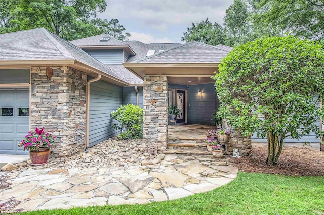 doorway to property featuring a garage