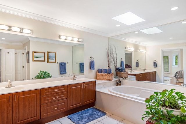 bathroom with tile patterned flooring, vanity, crown molding, and a skylight