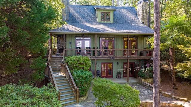 rear view of property with a patio area, french doors, and a deck