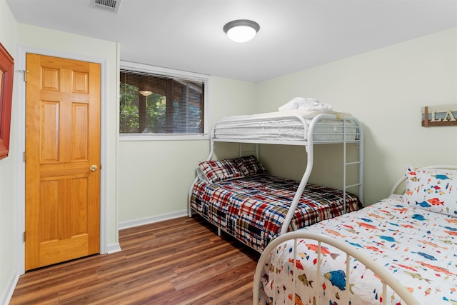 bedroom featuring dark hardwood / wood-style floors