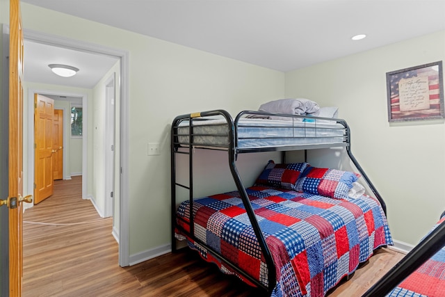 bedroom with hardwood / wood-style flooring