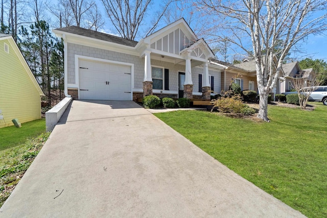 craftsman house with driveway, a porch, an attached garage, a front lawn, and stone siding