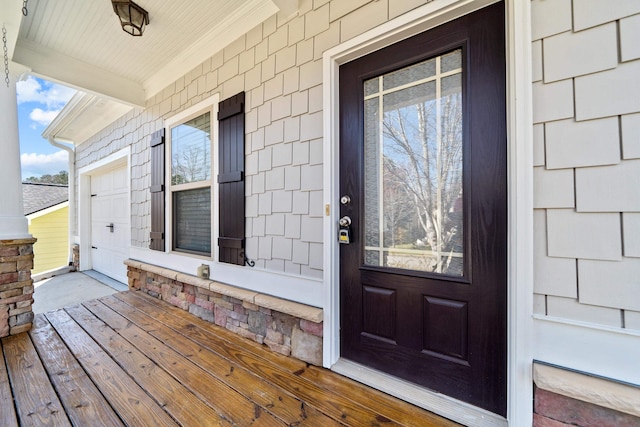 view of exterior entry featuring a porch