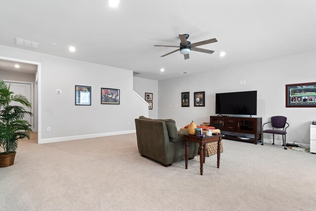 living room featuring ceiling fan and light carpet