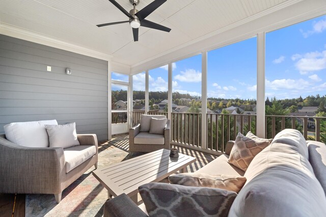 sunroom with plenty of natural light and ceiling fan