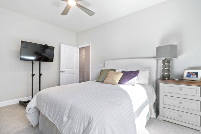 bedroom with light colored carpet and ceiling fan