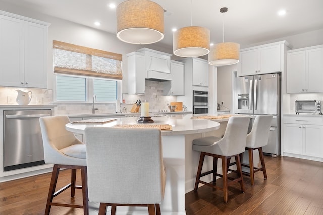 kitchen featuring a center island, white cabinets, and appliances with stainless steel finishes