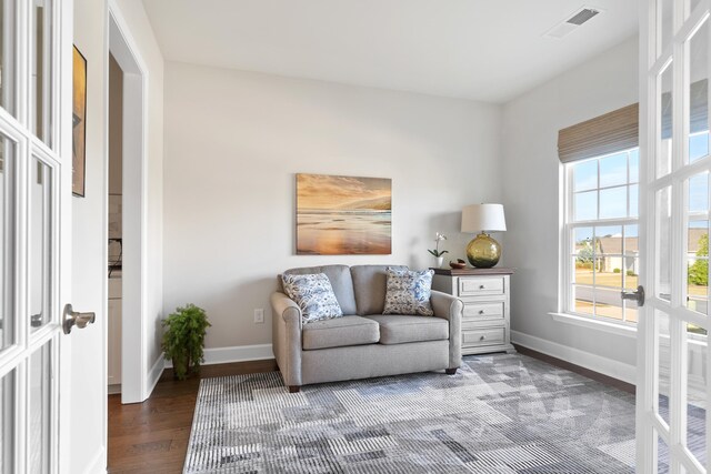 sitting room featuring dark hardwood / wood-style flooring