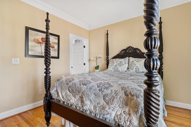 bedroom featuring ornamental molding and wood-type flooring