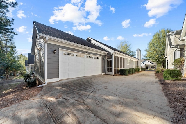 view of side of home with a garage