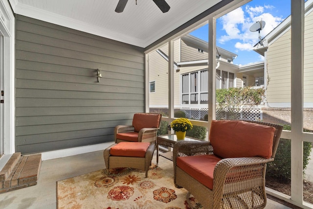 sunroom featuring plenty of natural light and ceiling fan