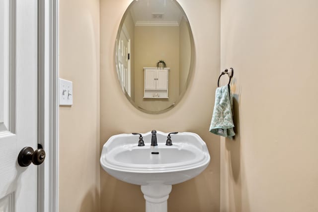 bathroom with crown molding