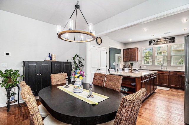 1000 Eight Knot Ct, Greensboro, GA 30642 - dining area with a chandelier, light wood finished floors, and recessed lighting