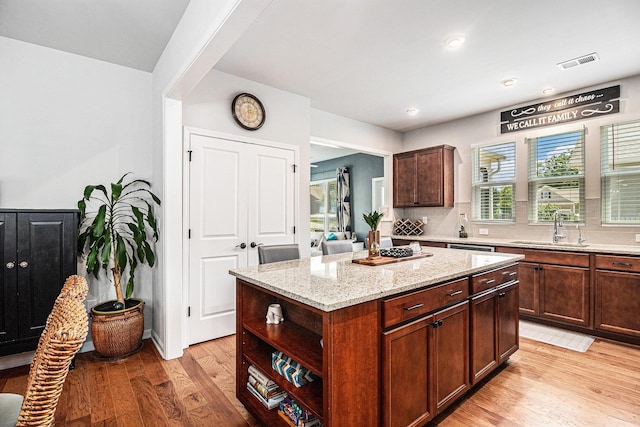 1000 Eight Knot Ct, Greensboro, GA 30642 - kitchen with a sink, light wood finished floors, light stone counters, plenty of natural light, and recessed lighting