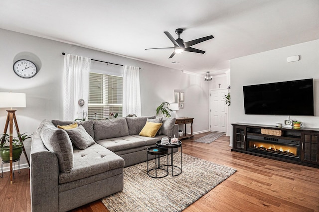 1000 Eight Knot Ct, Greensboro, GA 30642 - living area featuring a ceiling fan, wood finished floors, and baseboards