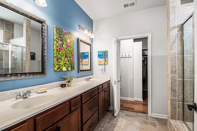 1000 Eight Knot Ct, Greensboro, GA 30642 - full bath with a stall shower, double vanity, a walk in closet, and baseboards