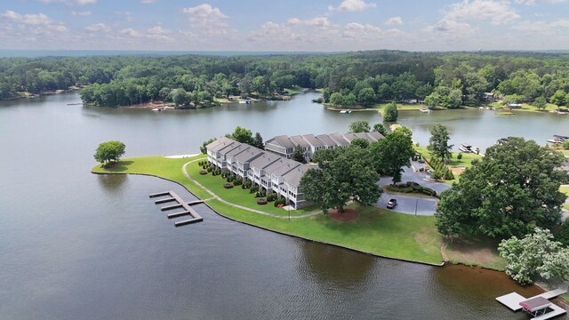 view of property's community featuring a water view and a yard