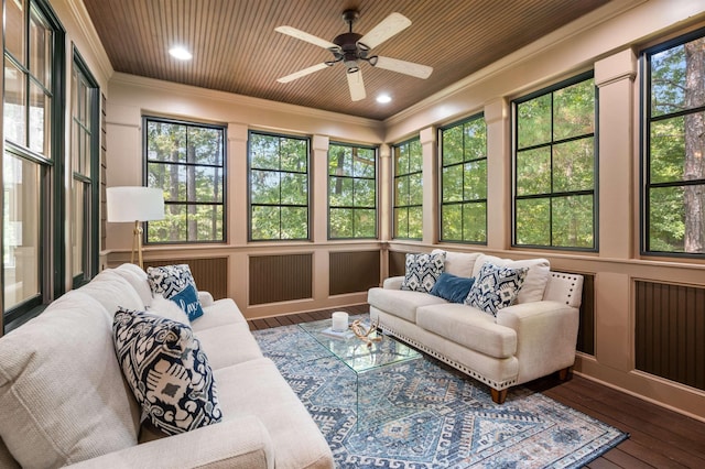 sunroom with ceiling fan, wooden ceiling, and a healthy amount of sunlight