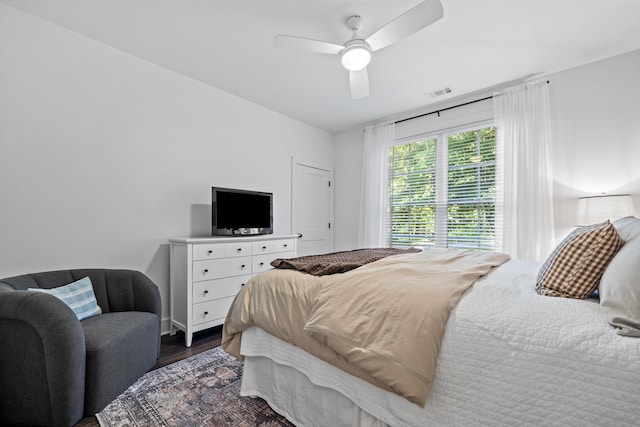 bedroom featuring dark wood-type flooring and ceiling fan