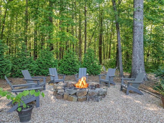 view of patio / terrace featuring an outdoor fire pit
