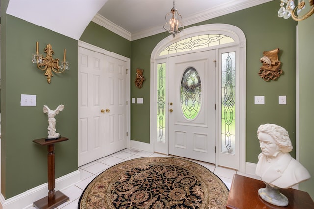 1811 Snug Harbor Dr, Greensboro, GA 30642 - foyer entrance with a chandelier, light tile patterned floors, and ornamental molding