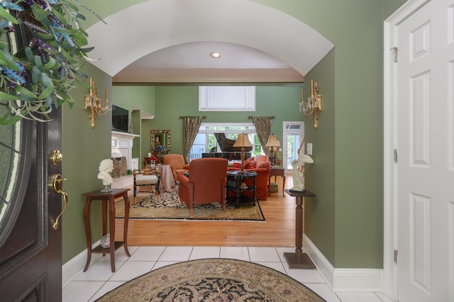 1811 Snug Harbor Dr, Greensboro, GA 30642 - foyer entrance featuring arched walkways, light tile patterned floors, and a fireplace