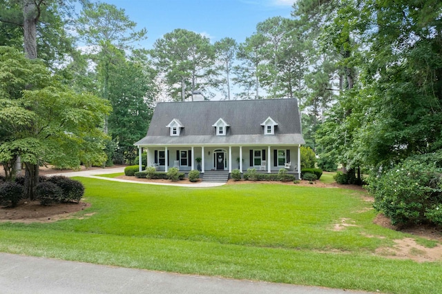 1811 Snug Harbor Dr, Greensboro, GA 30642 - new england style home with a porch, a front yard, view of scattered trees, and a chimney