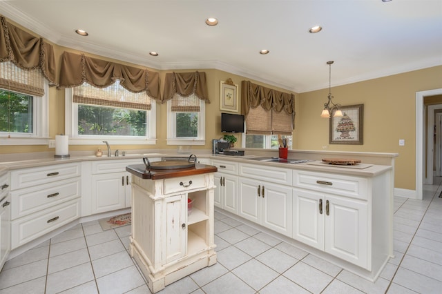 1811 Snug Harbor Dr, Greensboro, GA 30642 - kitchen featuring crown molding, recessed lighting, light tile patterned flooring, a kitchen island, and white cabinets