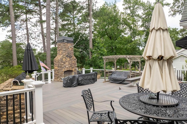 1811 Snug Harbor Dr, Greensboro, GA 30642 - deck featuring an outdoor stone fireplace and outdoor dining space