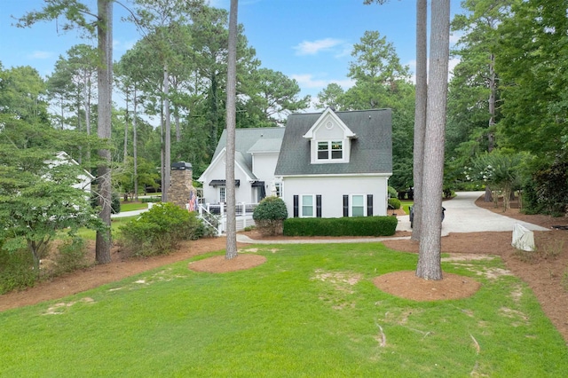 1811 Snug Harbor Dr, Greensboro, GA 30642 - view of front of property with a front lawn, view of wooded area, and roof with shingles