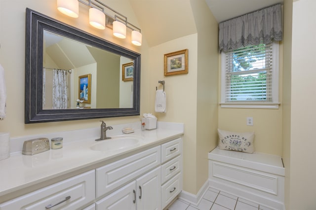 1811 Snug Harbor Dr, Greensboro, GA 30642 - full bathroom with vanity, tile patterned flooring, and vaulted ceiling