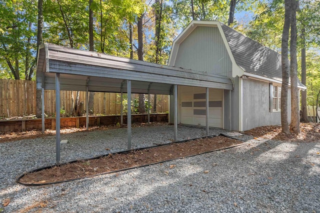 exterior space with a garage and a carport