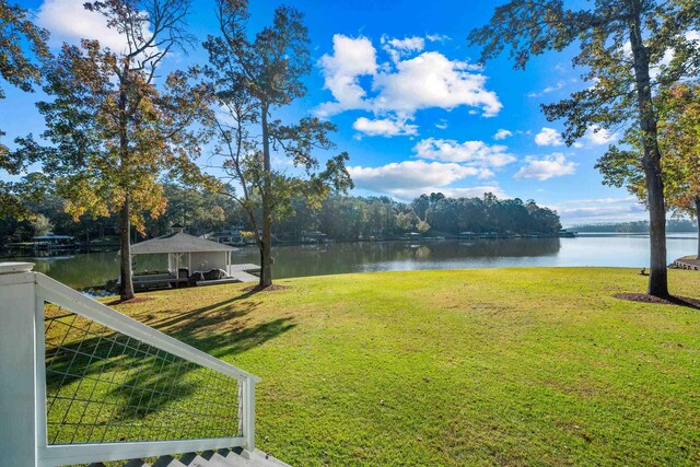 view of yard with a water view and a gazebo