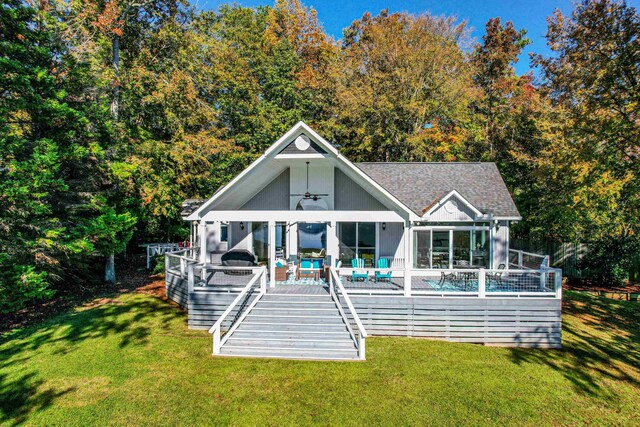 back of house with a yard, ceiling fan, and a deck