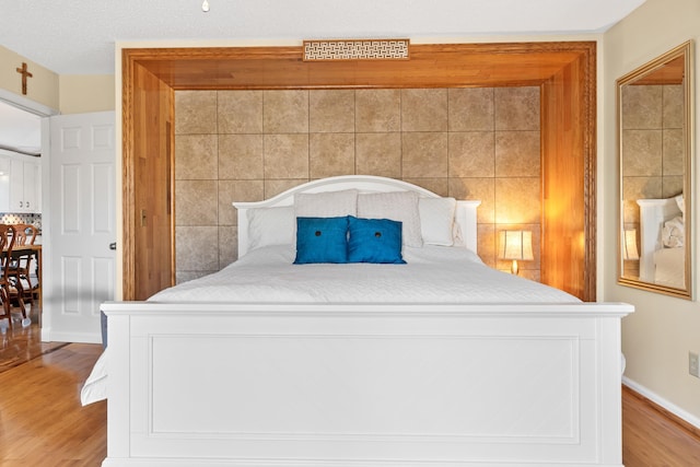 bedroom with light wood-type flooring