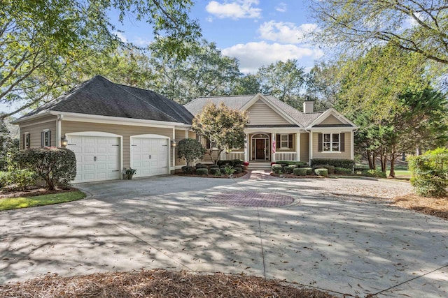 view of front facade featuring a garage and covered porch