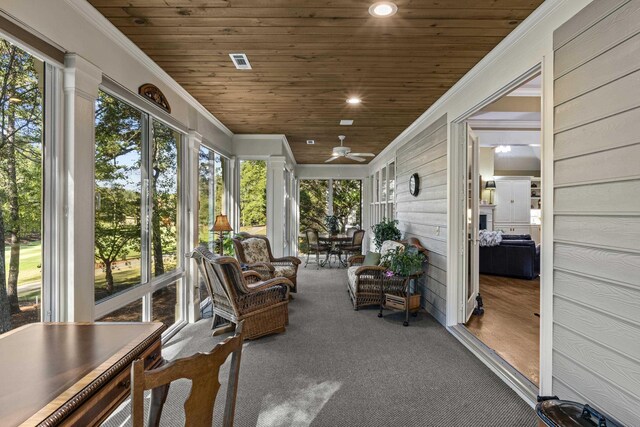 sunroom / solarium featuring wooden ceiling