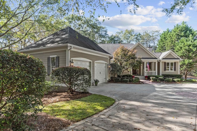 view of front of property with a garage and covered porch