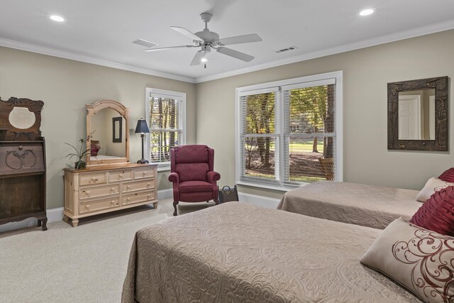 bedroom featuring light carpet, crown molding, and ceiling fan