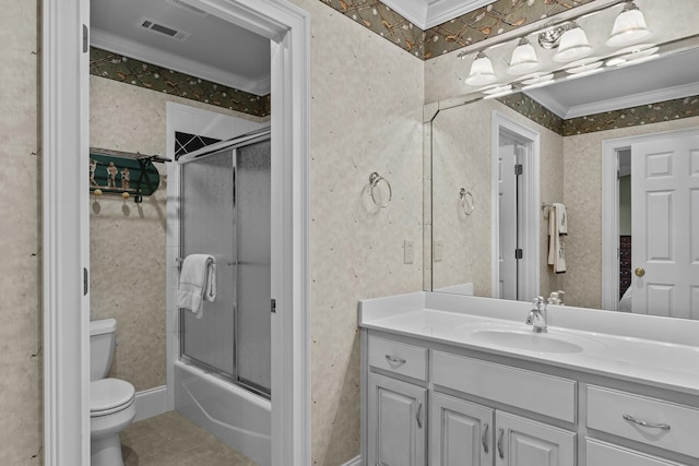 full bathroom featuring crown molding, vanity, shower / bath combination with glass door, and toilet