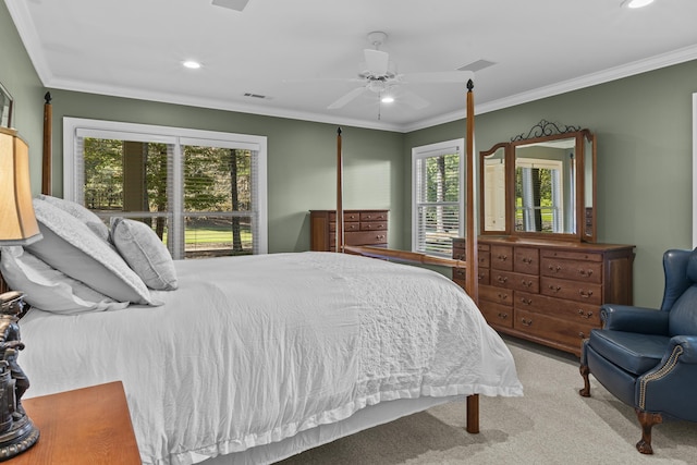 carpeted bedroom featuring ornamental molding and ceiling fan