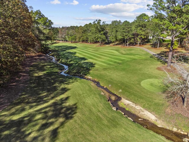 surrounding community featuring a yard