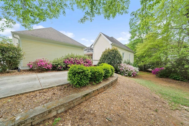 view of home's exterior featuring a shingled roof