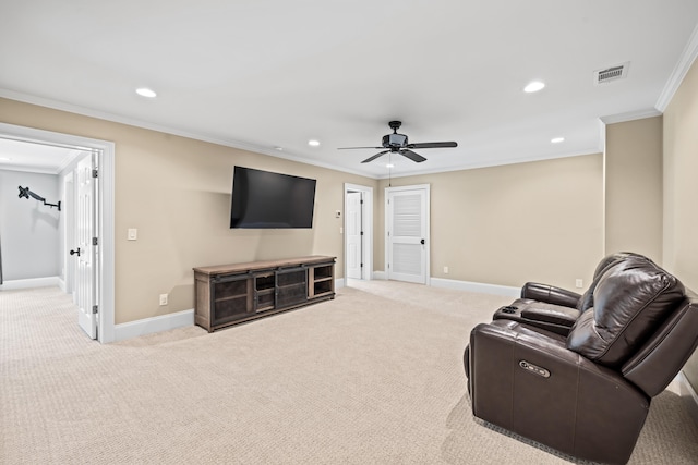 living room with crown molding, light colored carpet, and ceiling fan