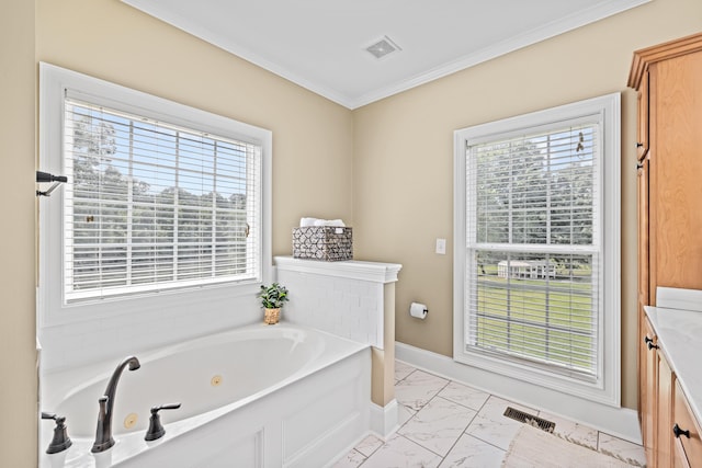 bathroom featuring crown molding and a bathtub