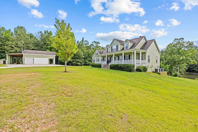 new england style home featuring a garage, central AC unit, an outdoor structure, a front yard, and covered porch